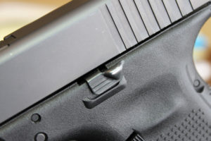 The extended slide stop lever.