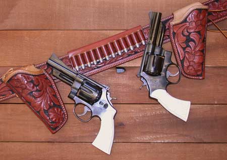 In the early 1980s S&W resurrected the .44 Special Model 24 for a limited run. This matched pair of 4" sixguns wear carved ivory stocks by Bob Leskovec and are carried in floral carved Tom Threepersons holsters from El Paso Saddlery.
