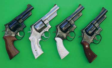 Smith & Wesson 4" .44 Specials: 1950 Target with shortened barrel, Model 624, Model 24- 3, and original 4"1950 Target.