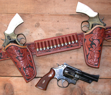 A pair of ivory-stocked 4" Model 24-3 S&W .44 Specials in El Paso Saddlery Tom Threepersons holsters along with an original 1950 Target .44 Special.