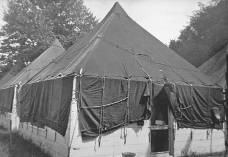 Typical competitors' quarters at Camp Perry in the 1950s and '60s. They had a cement floor and the furnishings consisted primarily of Army cots. The author's family would occupy one of these semi-tents for the duration of the matches his father shot in.