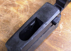 Looking up into the mag well reveals the mag catch’s latch. The Delrin proved to be a very effective and smooth surface for the mag.