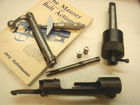 The tools the author used to re-barrel a mauser to 45 ACP.