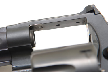 A replaceable, hardened steel shim prevents frame “cutting” from the gases of powerful Magnum cartridges. 