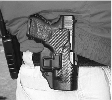 Author STRONGLY recommends some type of security holster to those who feel they must practice open carry. This carbon fiber Blackhawk SERPA with proprietary trigger-finger lock release mechanism is carried by a state police trainer in casual clothes. Pistol is baby Glock.