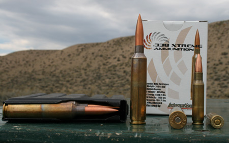 The 338 Xtreme next to a 308 Winchester.  The cartridge is made from a modified .505 Gibbs case.  The bullets are machined out of a copper alloy.