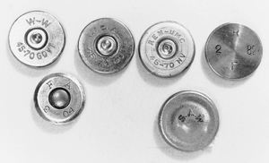 What headstamps tell you. Commercial ammunition is marked with the caliber and name of the manufacturer, at least in this country. Military ammunition is stamped with the code of the arsenal or manufacturer and the date of manufacture. Top, L. To R. 45-70 current head stamp; pre WWII commercial Winchester and Remington head stamps – good candidates for being mercuric primed; inside-primed military centerfire from the 1870's and 80's. “R” indicates a rifle load, “F” is the code of the Frankford Arsenal, “2 82" indicates it was loaded in February 1882. Bottom, (left) a Frankford Arsenal round loaded February, 1904. Right, Spencer 52 cal rimfire was made by the Sage Ammunition Works.