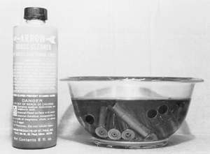 Liquid case cleaners contain a mild acid and require no more equipment than a stainless steel, plastic or glass pan to soak them in. Cases should be decapped before cleaning and either air-dried or oven-dried at no more than 150 degrees F.
