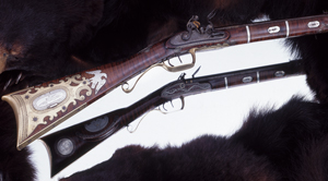 New England-made flintlock, half-stock rifle of exceptional quality; attributed to noted gunmaker Silas Allen of Shrewsbury, Massachusetts (1750-1834). Silver and brass mountings with silver wire inlays on the handsome curly maple stock. New England made rifles of this type were seldom embellished as elaborately. (As illustrated in Steel Canvas; The Art of American Arms, with permission of the author)