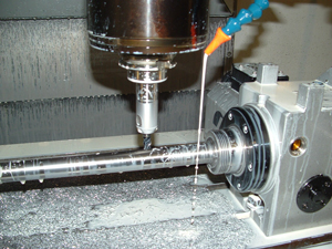 An endmill, guided by a CNC machining center, cuts a slot in a McGowen barrel. 