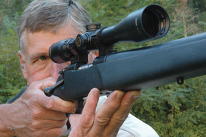 Author bears down offhand with a Weatherby Vanguard rifle and Bushnell Elite 6500 scope.