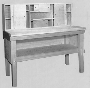 A basic reloading bench should be sturdy and have plenty of storage space. The individual design is up to the maker. This bench was built from plans formerly available from the National Reloading Manufacturers Association, which is now inactive.