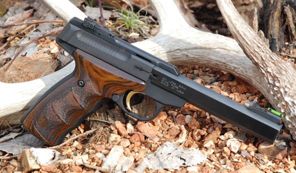 The Buck Mark Plus UDX offers a distinctive slab-sided barrel, fiber optic sights and grooved walnut grips. It is a very good-looking pistol.