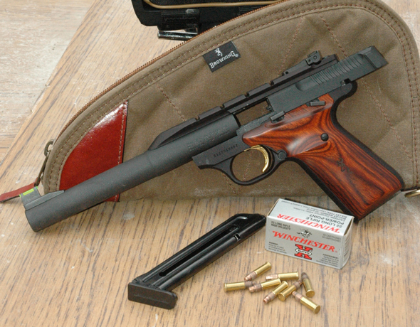The Browning Buck Mark Hunter, with its bull barrel and integral scope mount is ready for action in the woods. This pistol would do just fine for bringing down squirrels or the odd cottontail that happens to stand still long enough to present an ethical shot. 