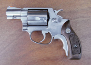 While their usefulness  is debatable, some  shooters prefer grip adapters  as depicted here on a Smith & Wesson Model 60. Since the installation is on the inside of the frame, added bulk is minimal.