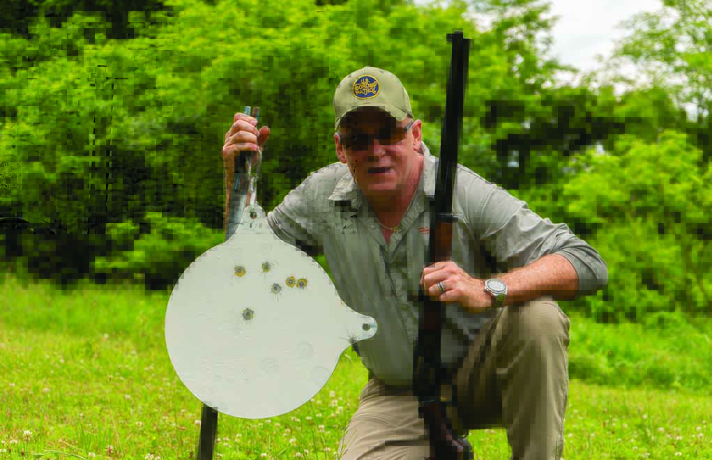 Shooting with sticks from the seated position, the author hit this 16-inch plate seven out of 10 times at 200 yards with the open-sighted Anniversary Marlin.