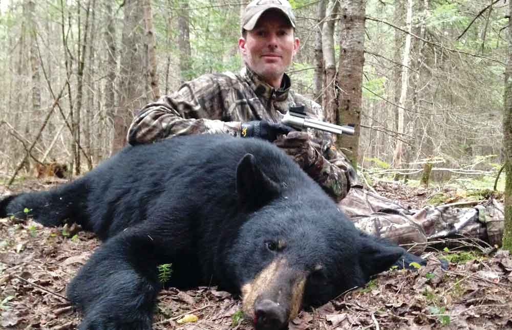 Kim Ralston took this Maine black bear at 45 yards using Freedom Arms Model 97 .45 colt with 5.5-inch barrel. It’s topped with a 4 MOA JPoint sight and shoots a Hornady 250 XTP over 20.5 grains of 2400. Photo by K. Ralston