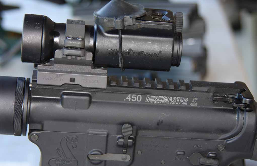 The .450 Bushmaster rifle they had us shooting at SHOT Show was equipped with a red-dot scope. That was all we needed to mangle targets at 100 yards.