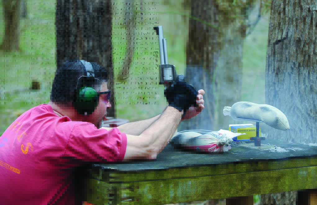 Big recoil is the norm with the big .50s. Here, the author test-fires a .500 JRH BFR off the bench.