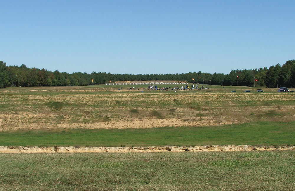 A view from the 1,000-yard line at Camp Butner, in North Carolina, the tiny targets and number boards are six feet square.