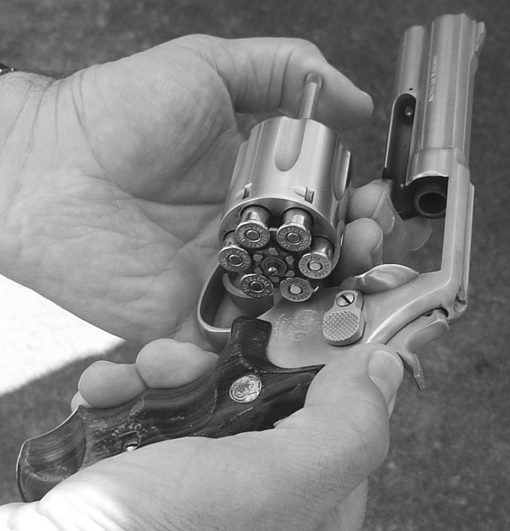 A partial reload of a revolver can be accomplished by working the ejector rod only part way, so spent cases can be plucked out and replaced by hand or from a Bianchi Speedstrip. The revolver is a Smith & Wesson Model 681, no longer produced. 