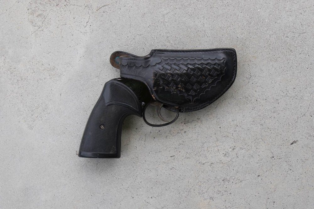 Once the national standard, holsters with exposed trigger guards are now banned from many ranges for safety reasons. This is S&W Model 12 Airweight .38 in Safariland thumb-break.