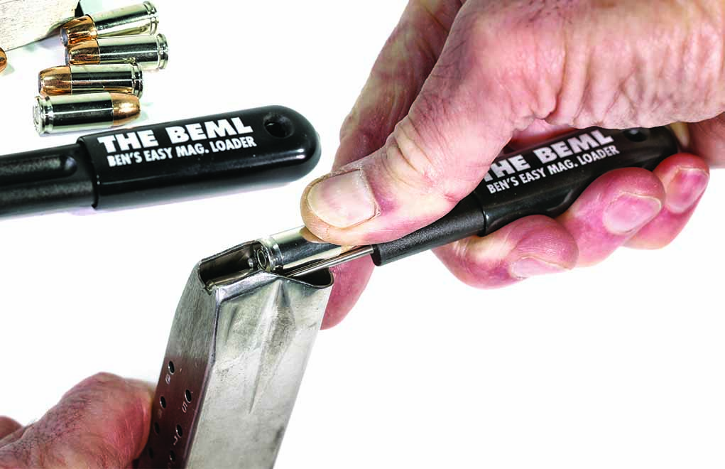 Use Ben's Easy Magazine Reloader's rods to depress the top cartridge. Then, slide the next one off the rods and under the feed lip.