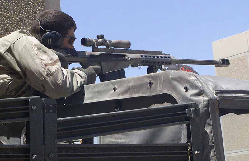 US Marine practices firing a Barrett M82A1 rifle just outside of An-Numaniyah Airfield in Iraq, during Operation IRAQI FREEDOM.