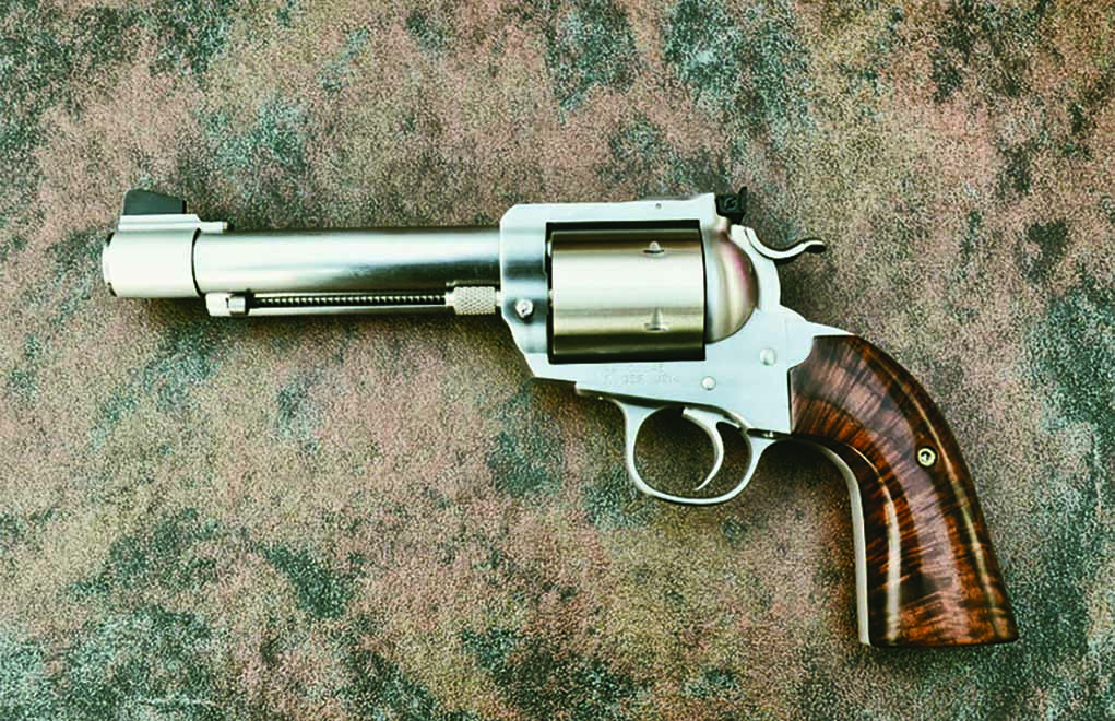 The resultant revolver now sports an aftermarket 5½-inch banded barrel, a six-shot oversized cylinder and custom walnut grips. It remains a .45 Colt.
