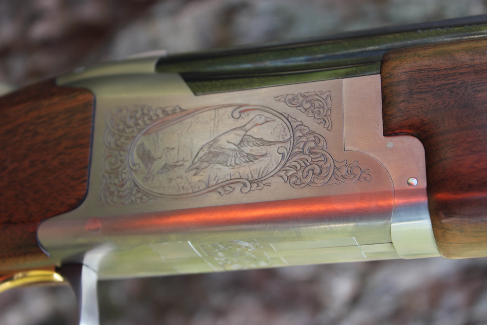 The 725’s steel receiver has a silver nitride finish and high-relief engraving. A duck adorns the right side of the field model, and a pheasant appears on the left. The receiver is narrower than older models, thanks to a smaller diameter full-length hinge pin.
