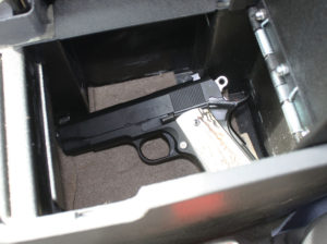 When the author is in unfriendly environs, he locks his unloaded pistol in a console vault. Notice there is no loaded magazine in there with the gun.