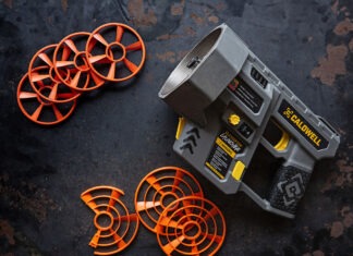 Caldwell ClayCopter Review: The Next Evolution Of Shotgun Fun A Caldwell ClayCopter Hand-Held Thrower next to its special clays on a black background.