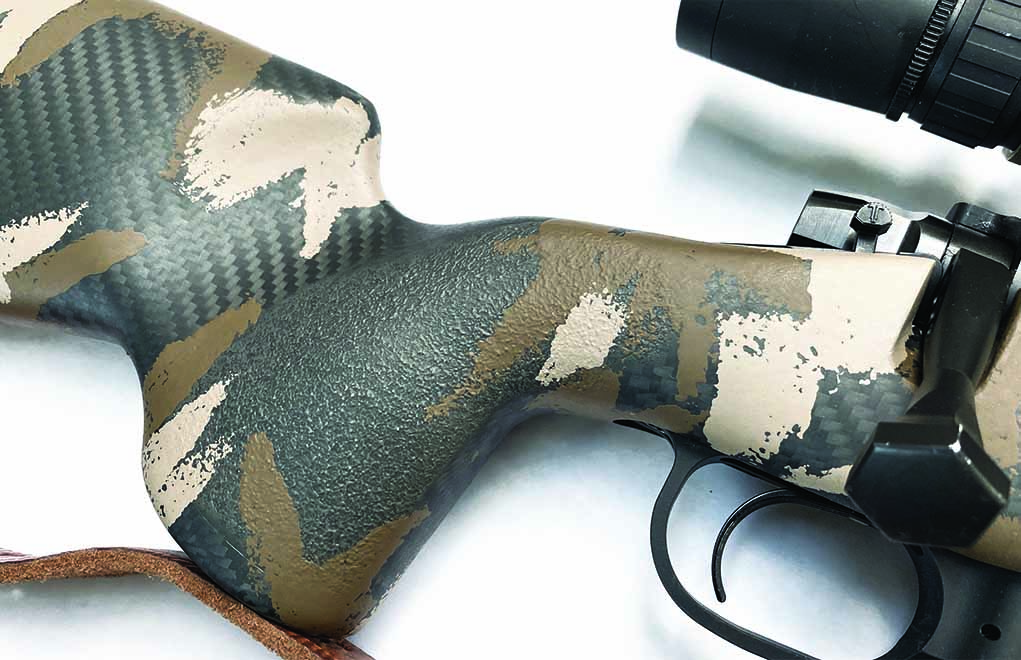 The Mesa’s carbon-fiber stock shows a tight weave pattern under the camo splotches. 