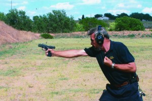 Ayoob has often used the SIG-Sauer as a teaching gun, as have many on his teaching staff. It stands up to heavy and demanding use. Here he demonstrates recoil control at a Texas class by sending a stream of brass upward, and a stream of 230 grain .45 hardball downrange, with P220 SAO.