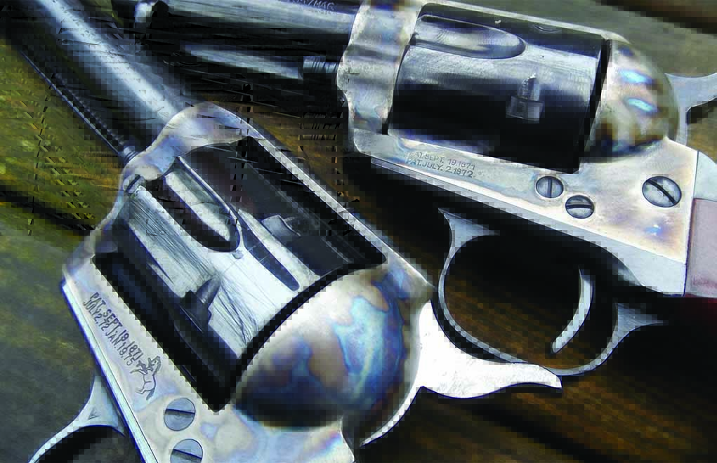 Note the differences in markings between the two guns. The Uberti (top) has CIP markings common in European guns and lacks a rampant colt stamp, despite retaining the patent date stamping.