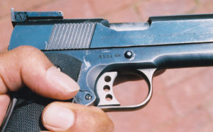 NM suffix is noted on serial number of author’s pet pistol. Signature Gold Cup style trigger was later replaced with this Videcki unit. Note slanted slide grooves, relieved ejection port, both standard on second incarnation of the National Match. This gun has the controversial light slide, not externally detectable.