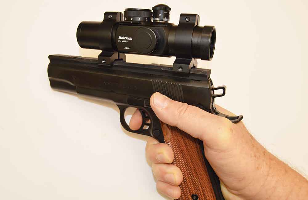 The UltraDot Matchdot II is a popular pistol for bullseye competition. Note the high grip on the gun, letting the shooter control the recoil and recovery during timed and rapid fire.