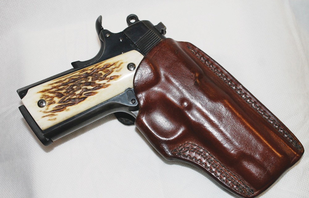 A holster fits the handgun snugly, like this formed-to-the-gun belt holster from Greg Kramer. This holds the gun firmly, yet allows for a smooth draw.