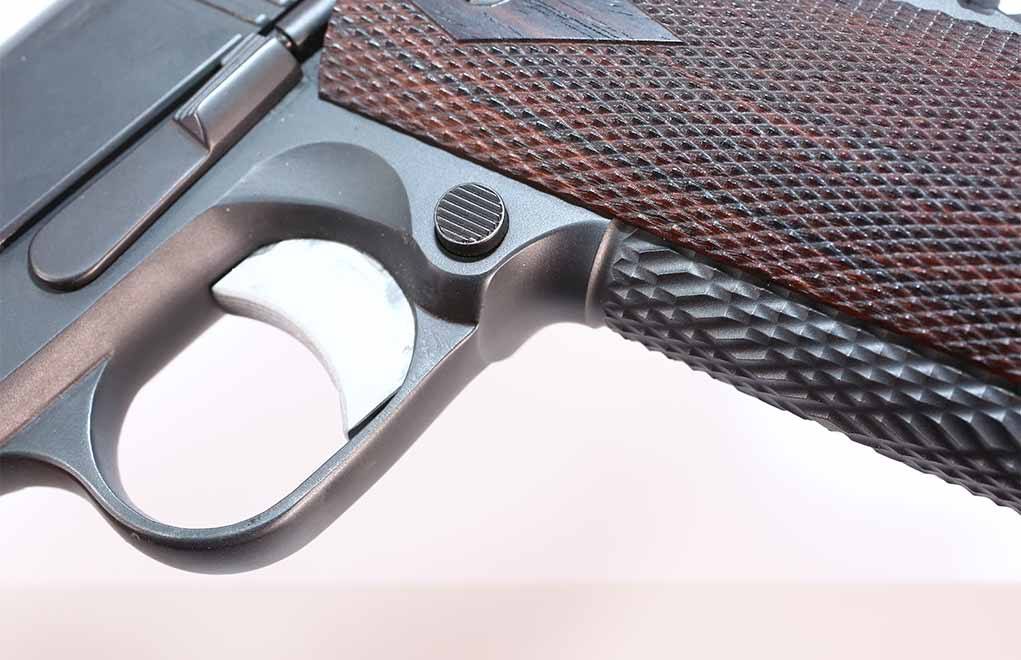 When Stan Chen cuts the ProTrac, he also lifts the frontstrap where it joins the trigger guard. This allows the shooter to get their hand higher on the gun.