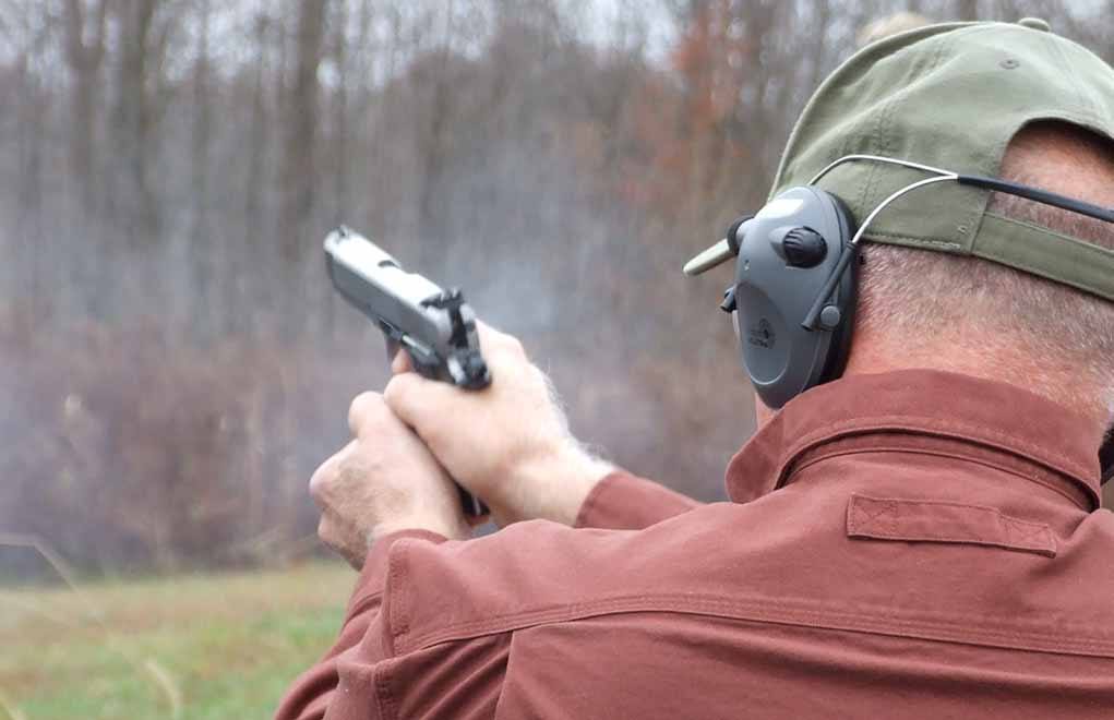 Retired Ohio probation officer and Colt 1911 aficionado Michael Skeen tests the Ruger .45 ACP Officer-Style 1911 pistol. The solid stainless steel frame and slide keep recoil controllable even when firing SIG’s 230-grain Elite V-Crown .45 ACP ammo. Empties were ejected smartly forward and to the right of the shooter.