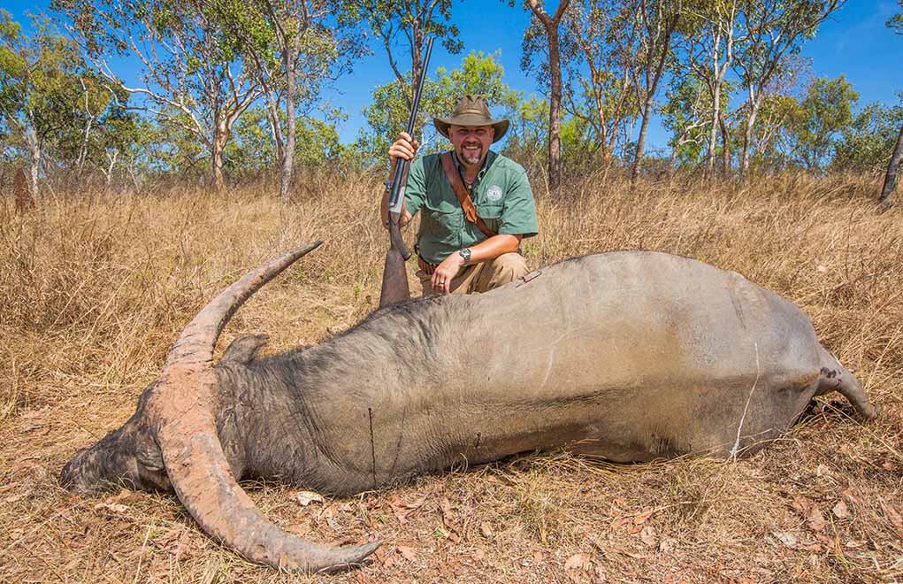Massaro with an Australian water buffalo, taken with a Heym .470 and a Trijicon red-dot. 