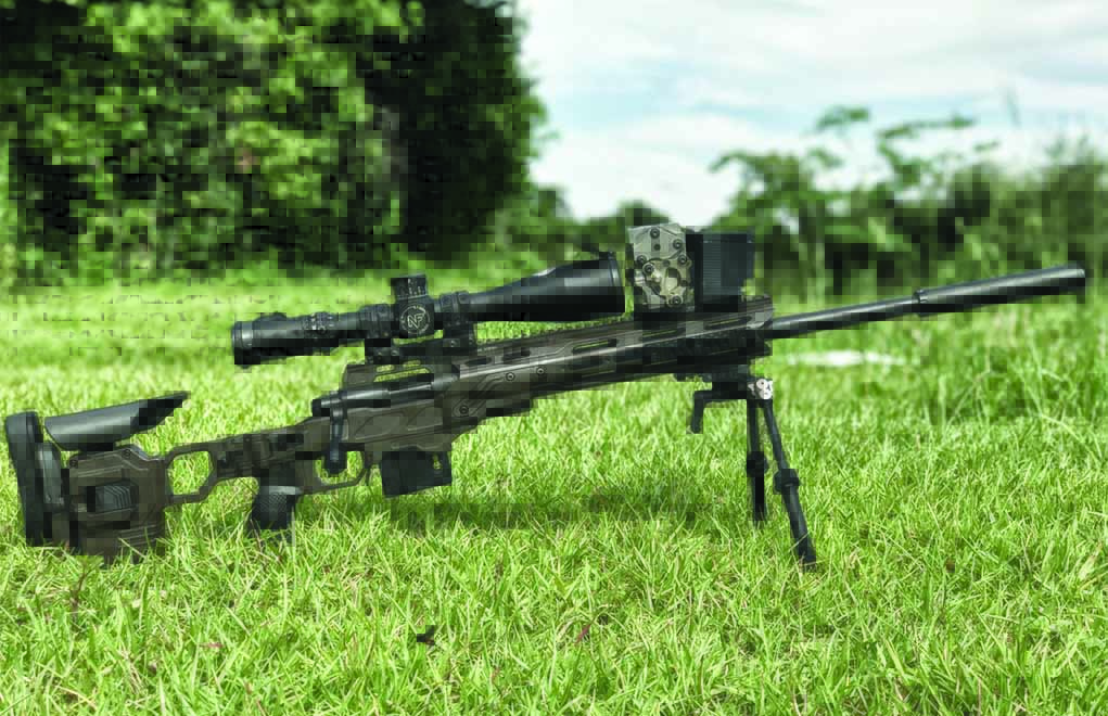 A.J. Stewart’s 1,000-yard .22 LR rig: a Vudoo V-22 action, 22-inch MTU contoured ACE barrel, Cadex Defense chassis, Nightforce ATACR 7-35x56mm scope with a rail-mounted Charlie TARAC and GSL suppressor. Note: His first 1,000-yard hits were made with a much-less-expensive Athlon Ares ETR optic.