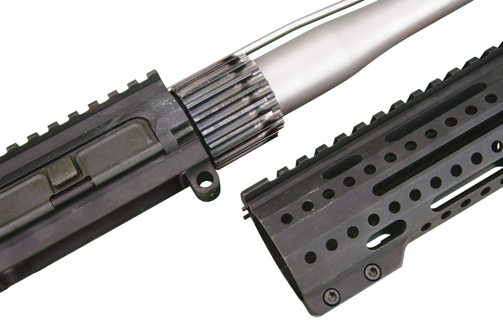A multi-finned barrel nut serves to anchor the free-floating handguard.