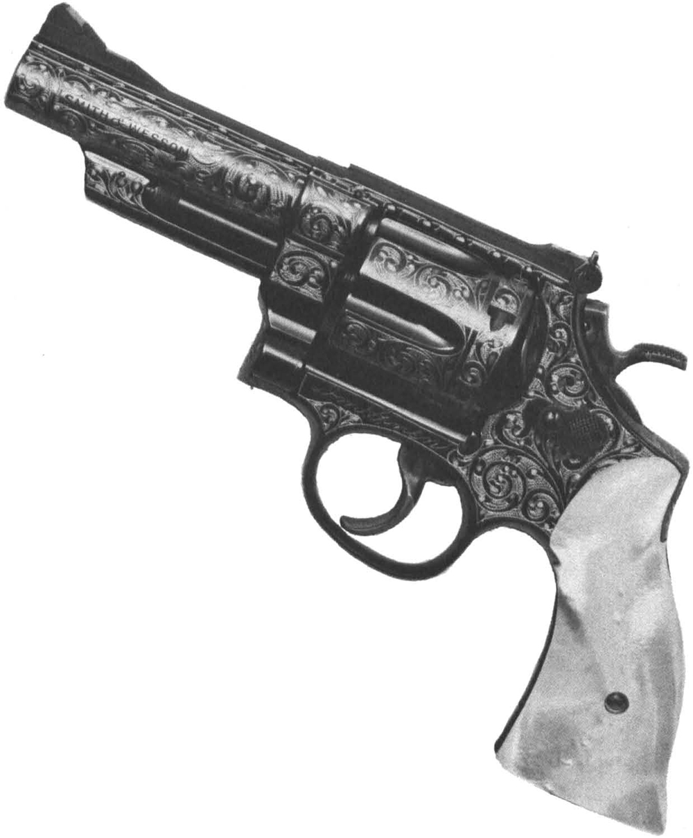 The first S & W 44 Magnum with 4-inch barrel, engraved and stocked by the Gun Reblu Co., Biltmore, N. C.