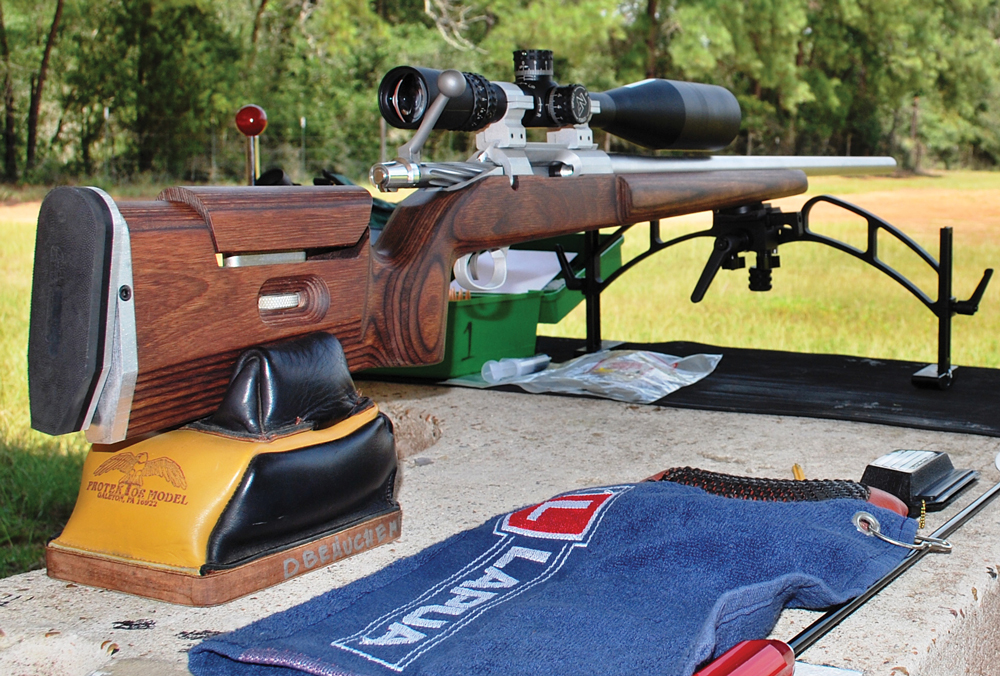 The author’s latest F-TR rifle on its first outing for load development. Notice the one-piece cleaning rod and the bore guide. The syringe near the ammo box is used to apply a special grease at various points on the bolt.