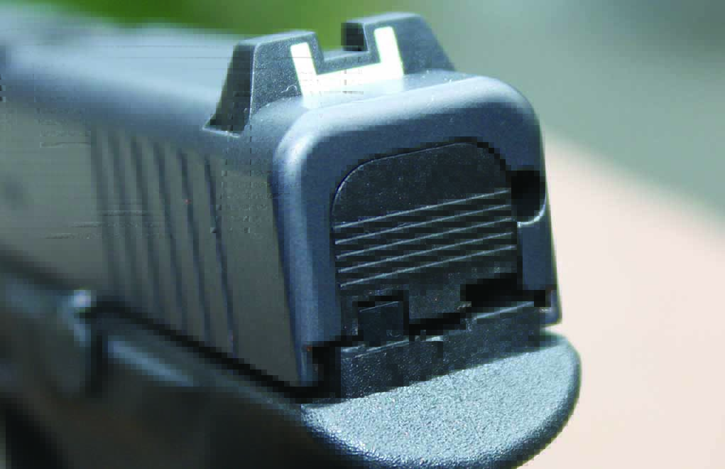 Rear sight of the G42 is dovetailed and has a white outline square notch. Notice the upper rear of the frame and the nice beavertail effect. Author photos