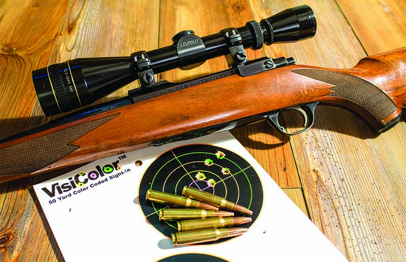 The author’s .308 Winchester and a 1.5-MOA group. This rifle has taken many different species, even though it isn’t the most accurate. 