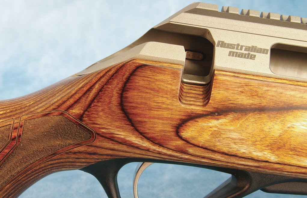 The rear of the receiver is machined to perfectly match the top line of the grip.