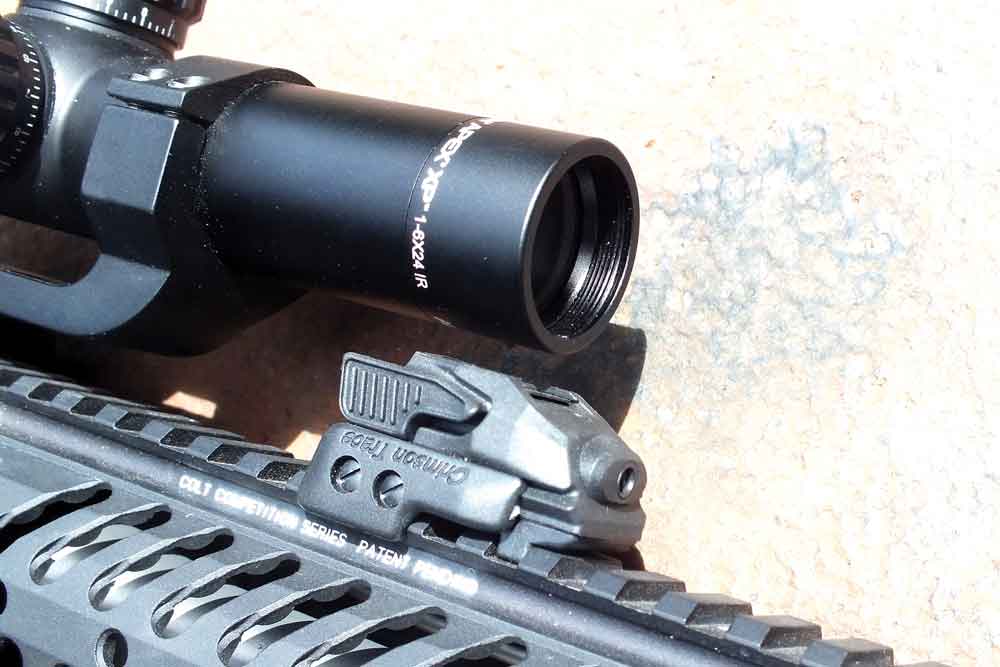 This Crimson Trace CMR 206 laser, mounted on the top rail of this Colt CRP 18, offers a closer bore to laser alignment than traditional bottom rail mounting and allows for cowitness with the scope. - laser sight 4