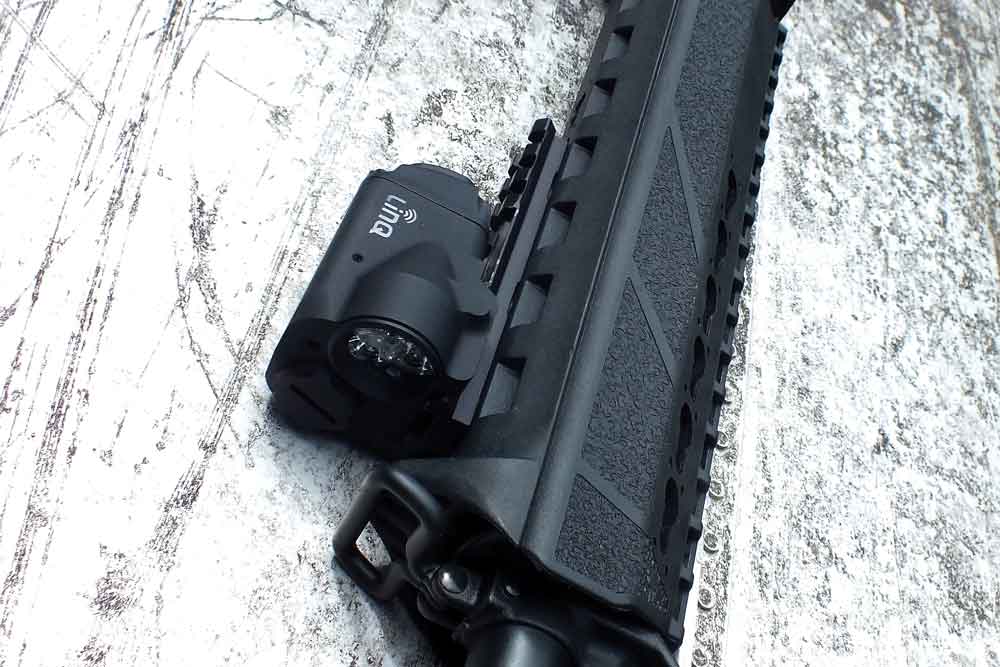 On a purely defensive carbine, the Crimson Trace LiNQ system provides both light and laser as a wireless passive activation system. - laser sight 2